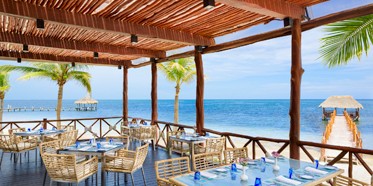 Dine by the beach at Azul Beach Resort Riviera Maya