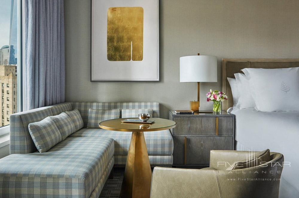 Guestroom with small sitting area at Four Seasons New York Downtown, NYC